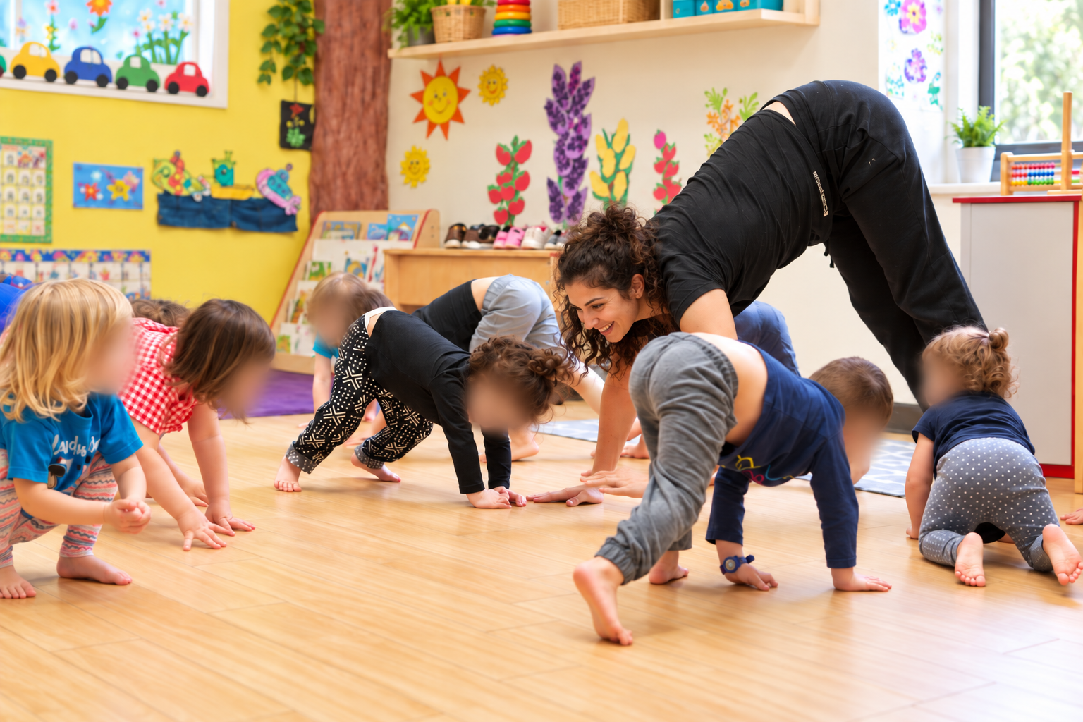 Children and teachers moving and playing together in an HCA classroom